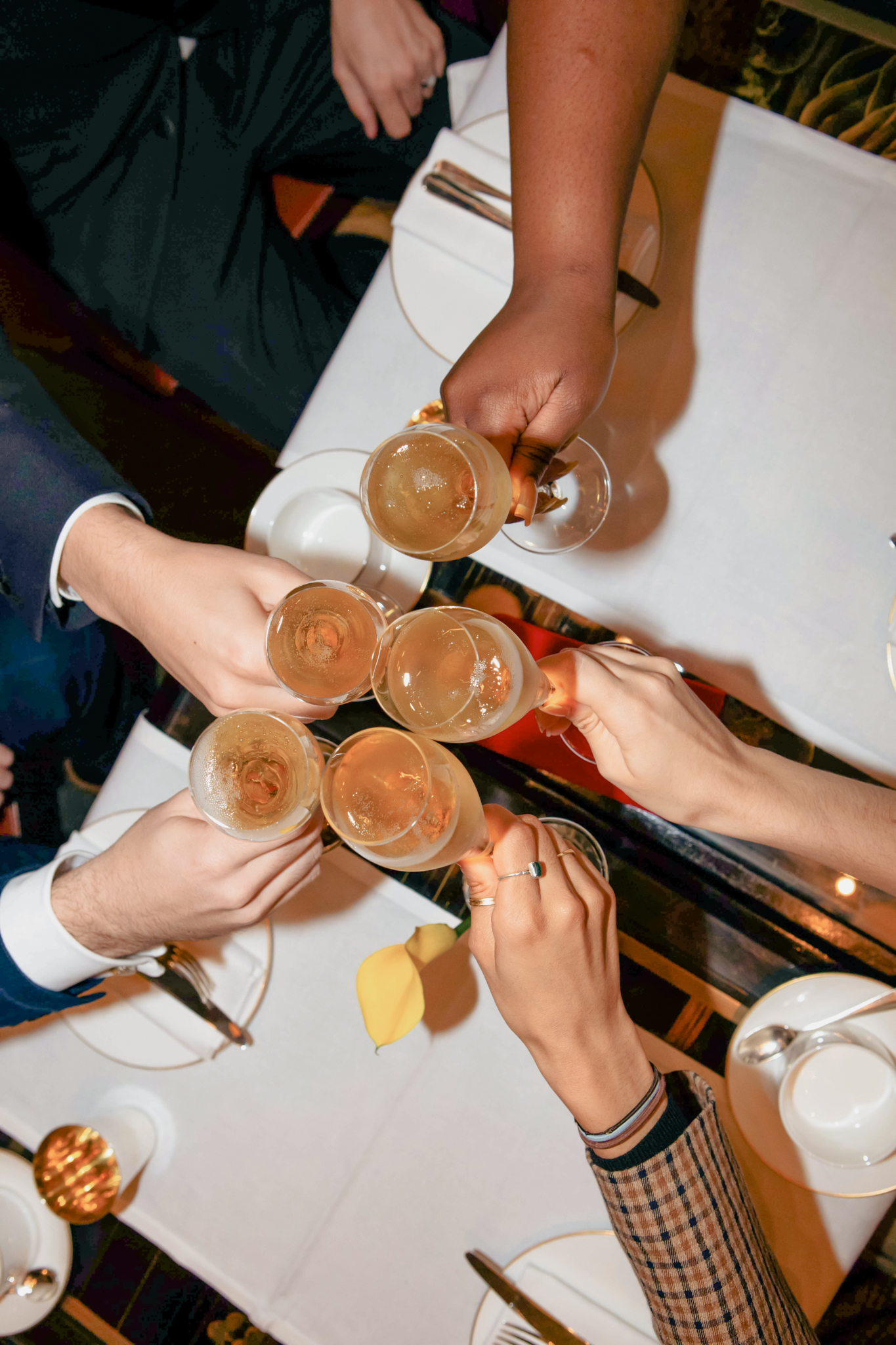 Guest table toasting glasses